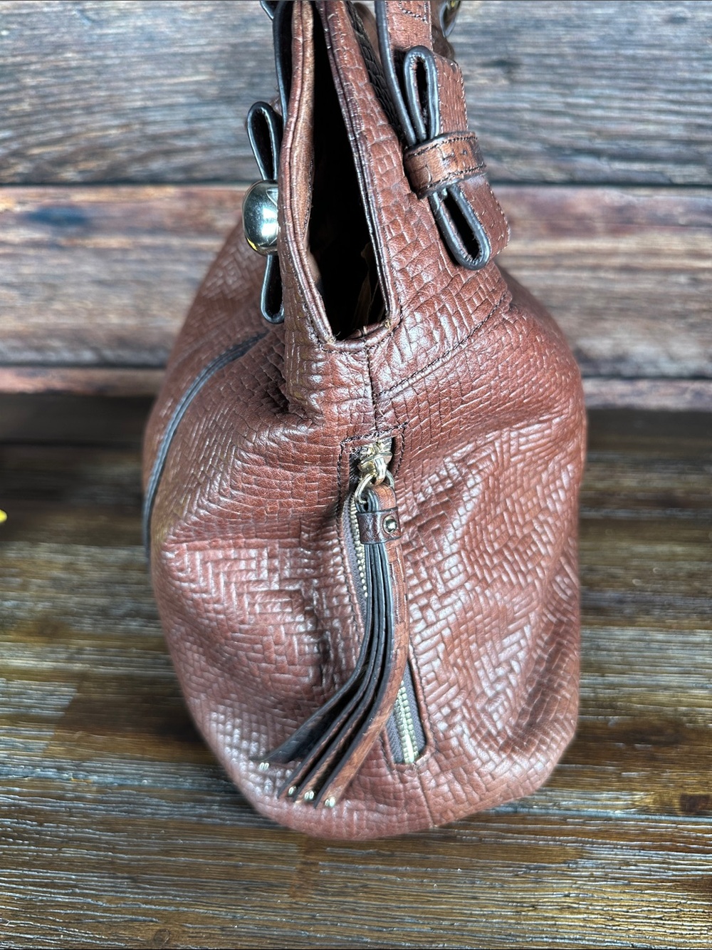 B. Makowsky brown leather shoulder bag with a textured, woven embossed pattern. - Picture 3 of 10
